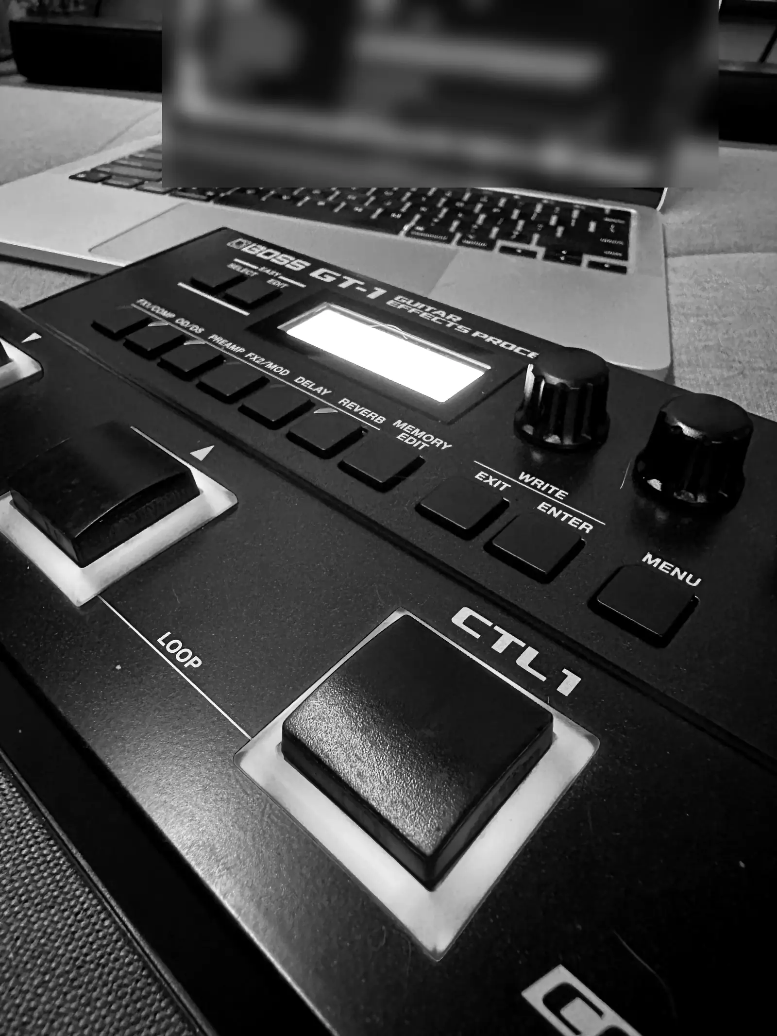 The BOSS GT-1 up front, a laptop behind it